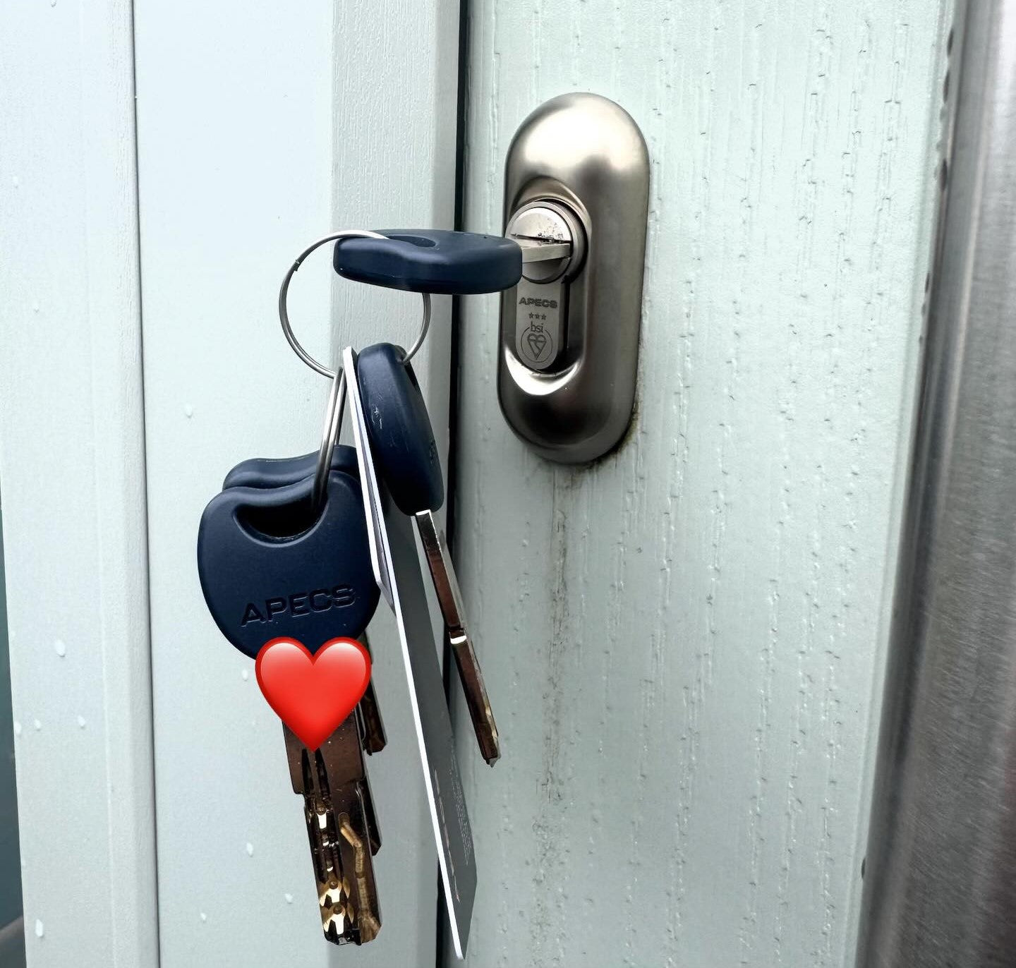 Apecs TS007 3 star euro lock and  keys with a heart-shaped keychain attached 