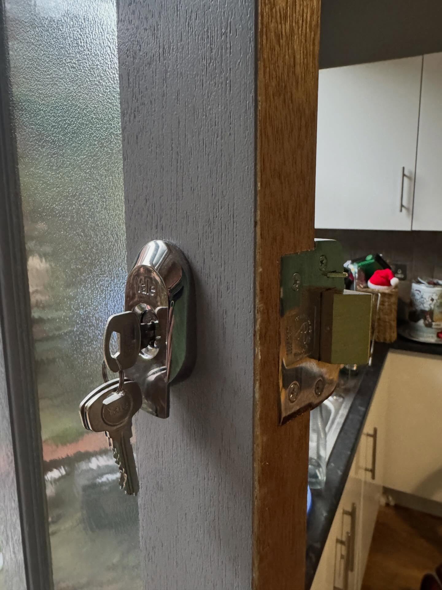 Yale BS3621 night latch fitted to grey and brown wooden door in Millhouses 