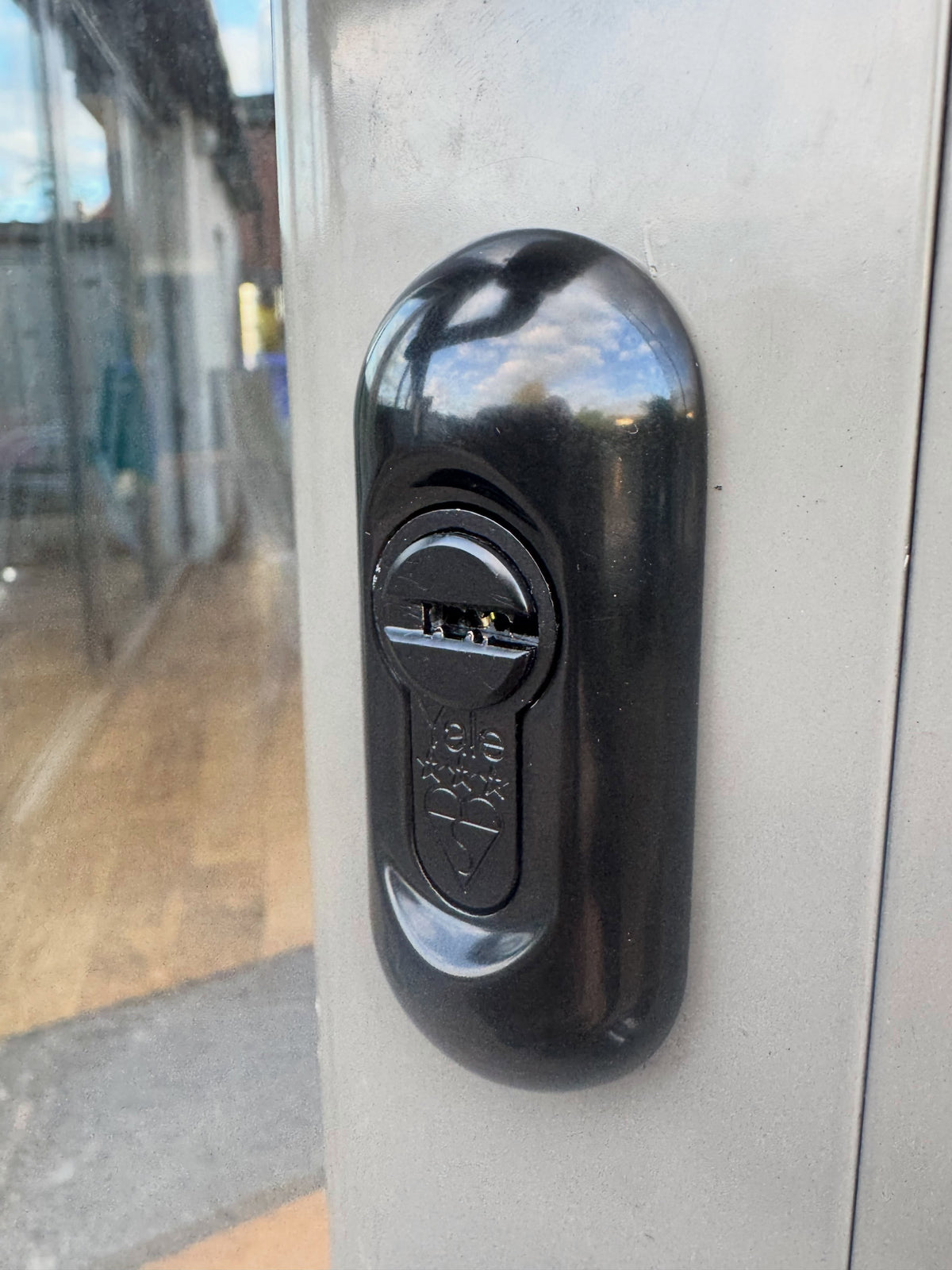 Black Yale 33 star lock fitted into a black escutuon cover