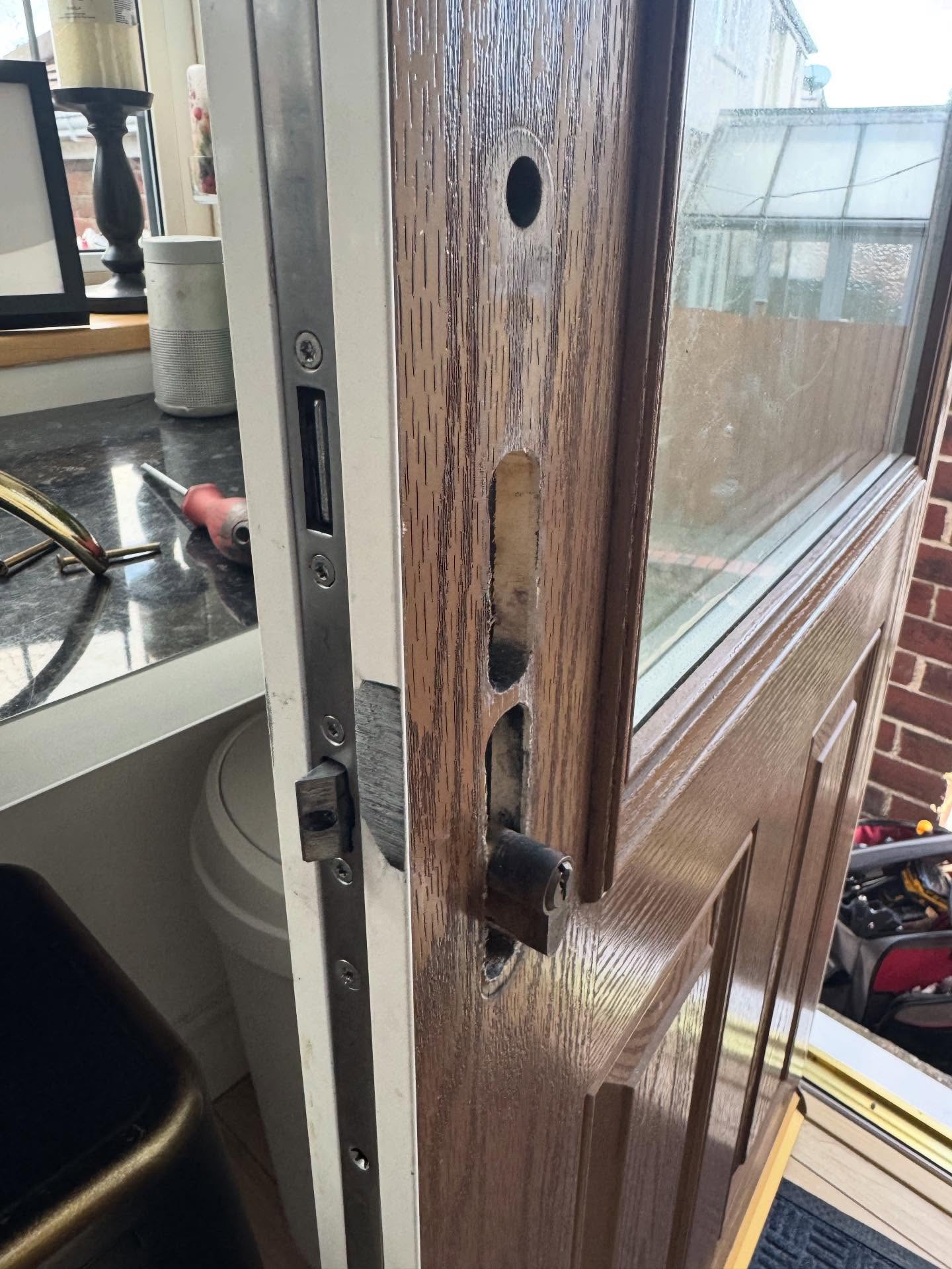 composite door with a lock mechanism being replaced 
