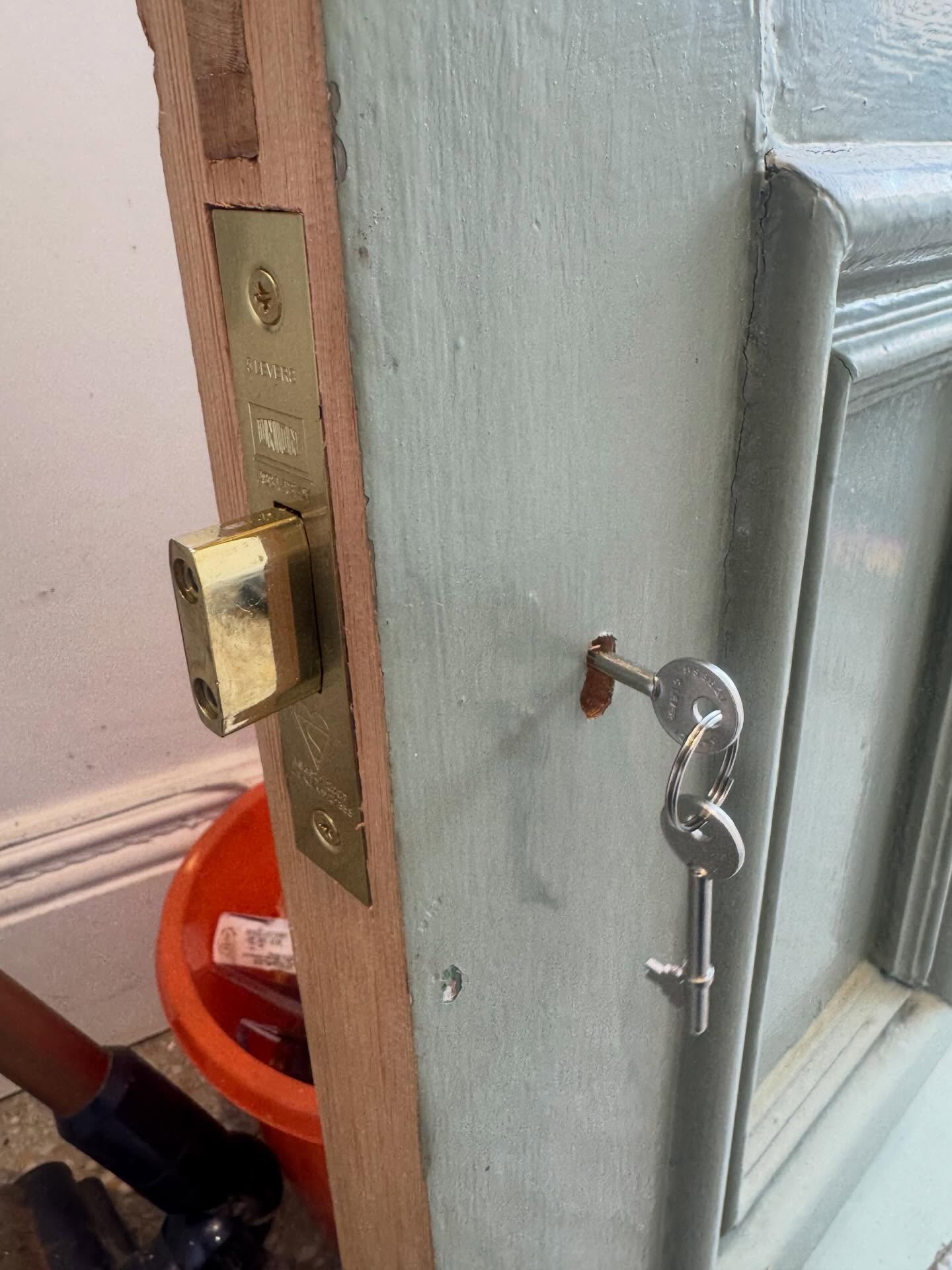 British Standard mortice dead lock in brass with keys in the lock