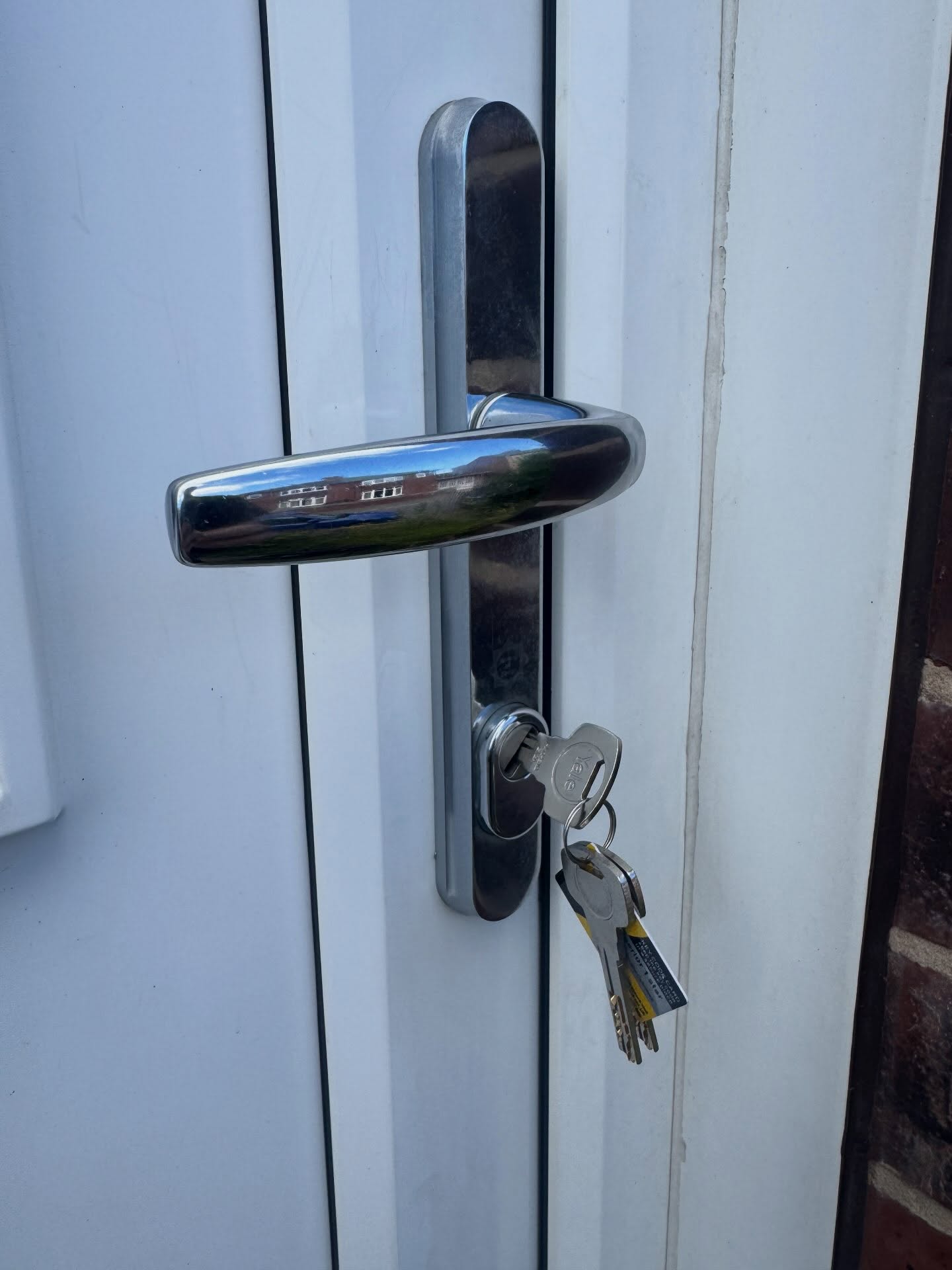 white upvc door with chrome 2 star high security door handle 