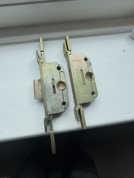 2 x broken Sarecen window gearboxes laid on white wooden shelf 