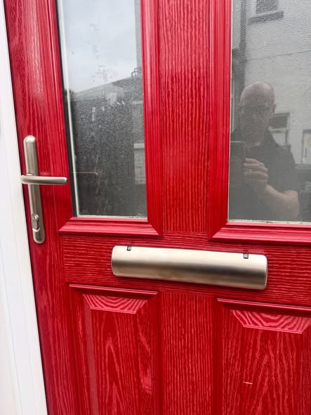 Sweet letterbox and handles fitted to red composite door 